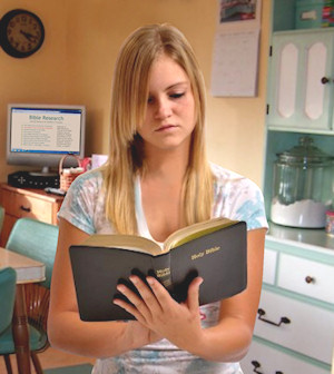 girl reading Bible